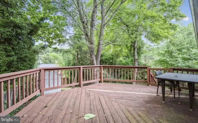 a view of a wooden deck and a yard