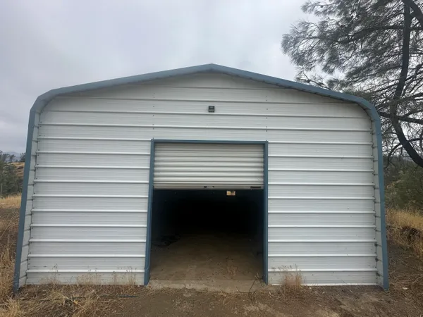a view of a row of palm trees in front of a house