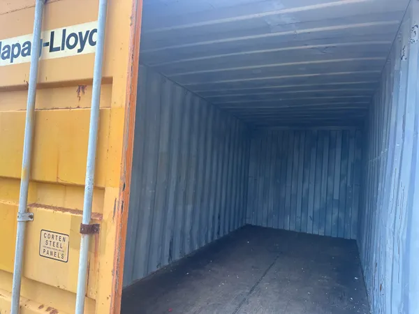 a view of a wooden house with a yard