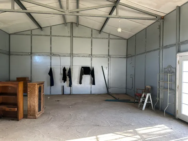 a view of a room with wooden walls