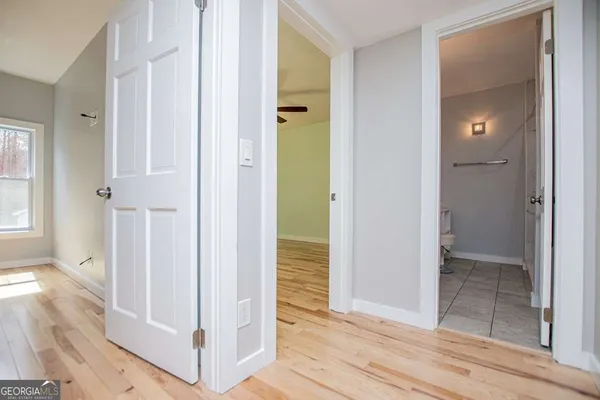 a view of a room with gym equipment and a window