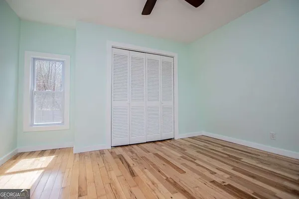 a bathroom with a sink vanity and a mirror