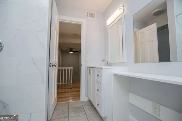 a view of balcony with wooden floor and outdoor seating