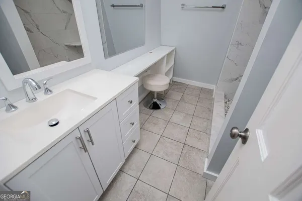 a view of a two chairs in the balcony