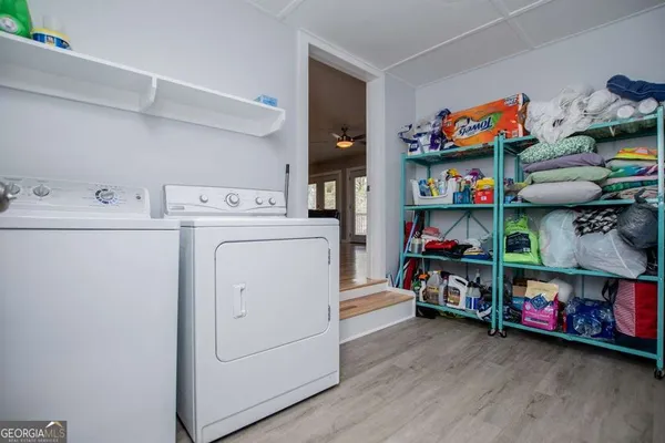 a view of balcony with wooden floor and outdoor seating