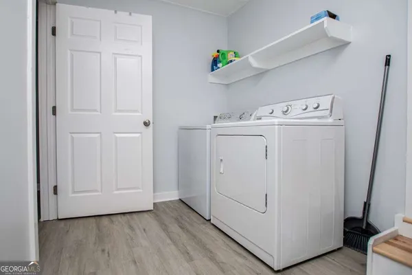 a wooden bench sitting in the middle of a lake