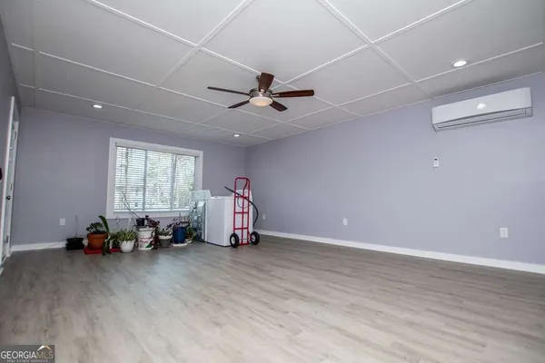 a view of a balcony with wooden floor