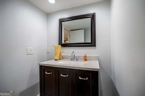 a living room with large windows and wooden floor