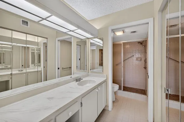 a bathroom with a glass shower door