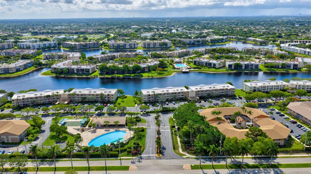 7214 South Devon Drive, Unit 7214 Tamarac, FL 33321 - Photo 23 of 24 an aerial view of residential building and lake view