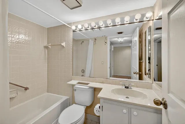 a bathroom with a sink and mirror