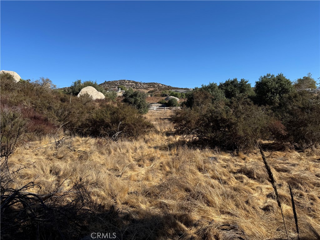 0 Ballinger Road Hemet, CA 92544 - Photo 5 of 9 a view of a dry yard with mountains in the background