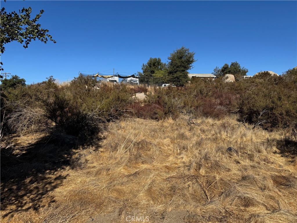 0 Ballinger Road Hemet, CA 92544 - Photo 6 of 9 a view of a dry yard with mountains in the background