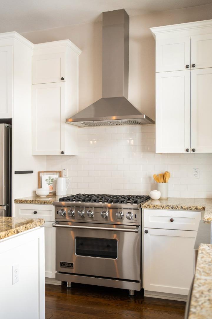 525 Fierro Loop Campbell, CA 95008 - Photo 12 of 48 a kitchen with granite countertop white cabinets and white appliances