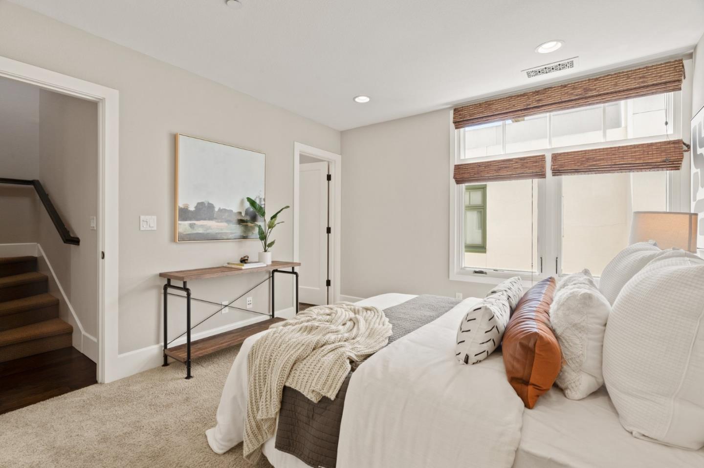 525 Fierro Loop Campbell, CA 95008 - Photo 32 of 48 a bedroom with a bed and a chandelier