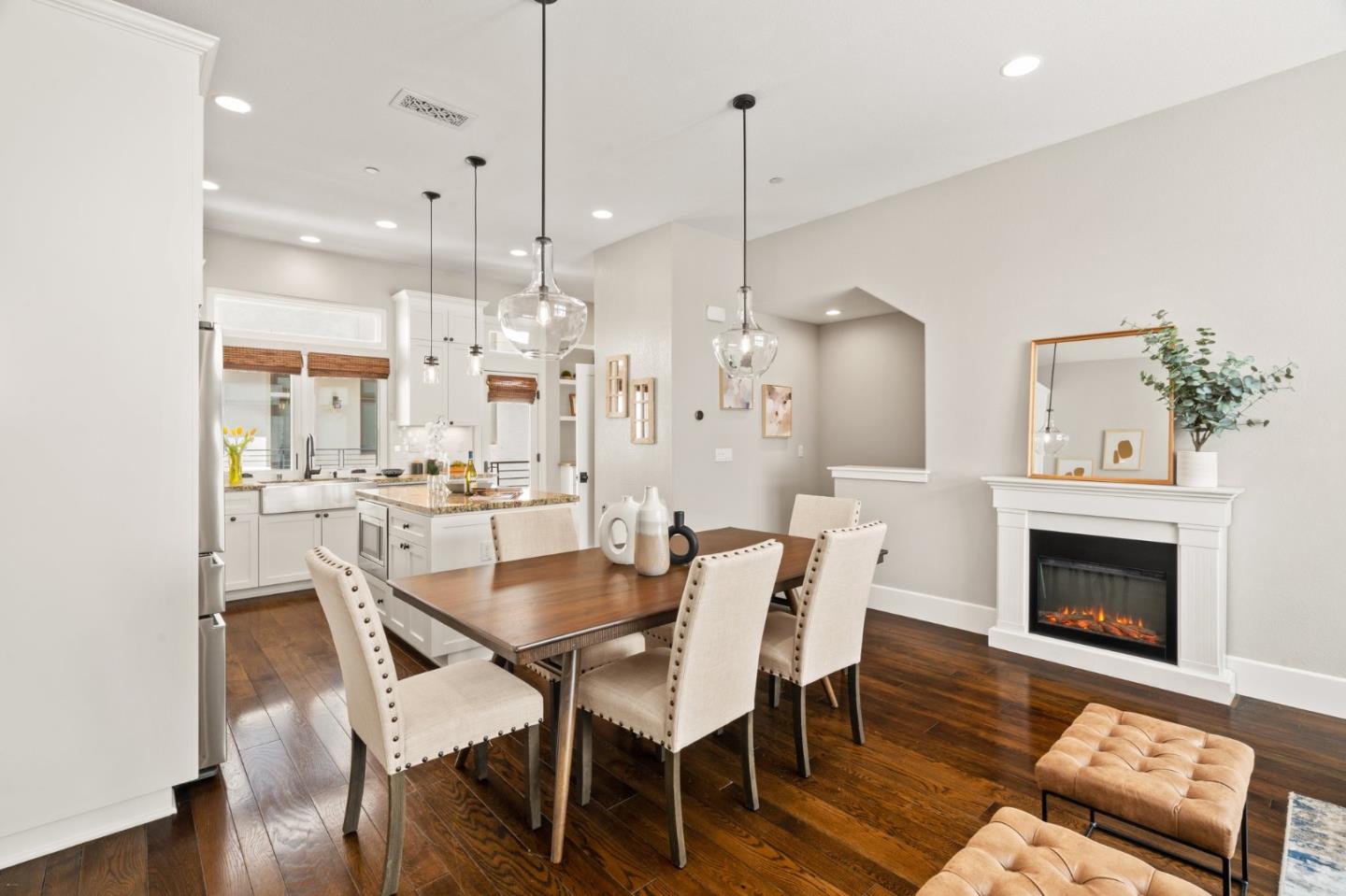 525 Fierro Loop Campbell, CA 95008 - Photo 9 of 48 a dining room with furniture a fireplace and wooden floor