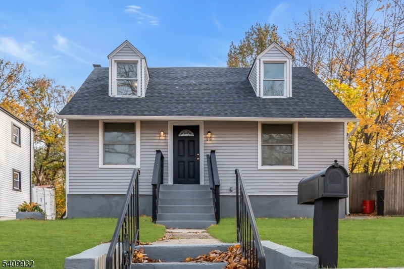 26 Center Oak Avenue Lawnside, NJ 08045 - Photo 3 of 12 a front view of a house with garden