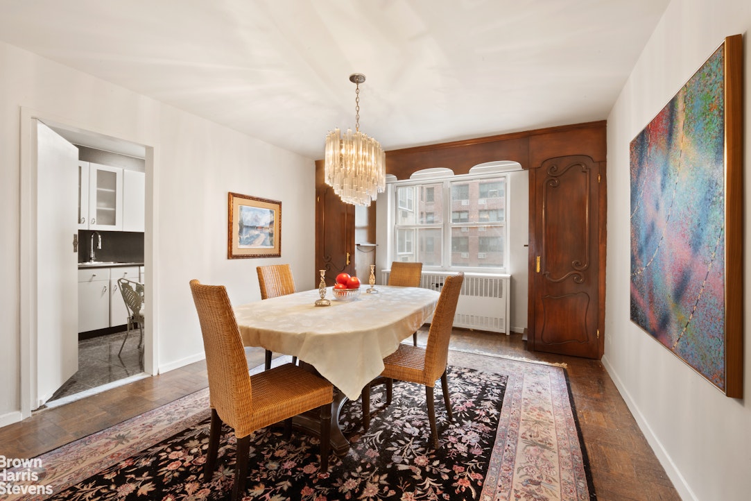 135 East 83rd Street, Unit 7A Manhattan, NY 10028 - Photo 2 of 8 a view of a dining room with furniture window and wooden floor