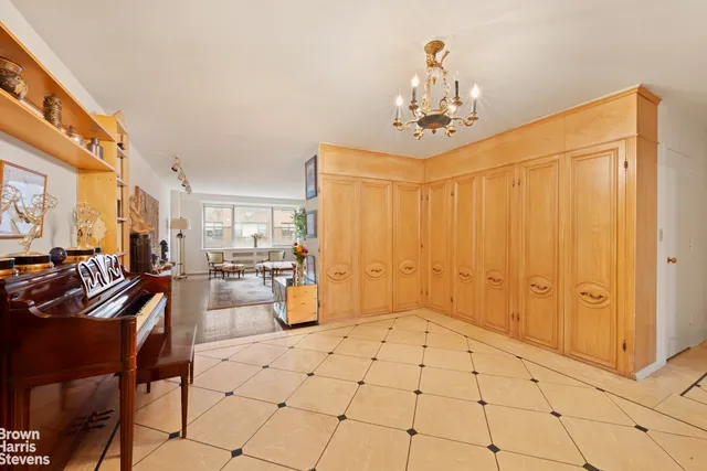 a view of a livingroom with furniture and chandelier