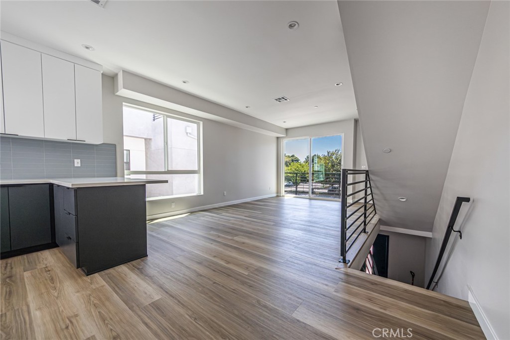 6700 Balboa Boulevard, Unit 1 Van Nuys, CA 91406 - Photo 12 of 54 a kitchen with wooden floors and wooden cabinets