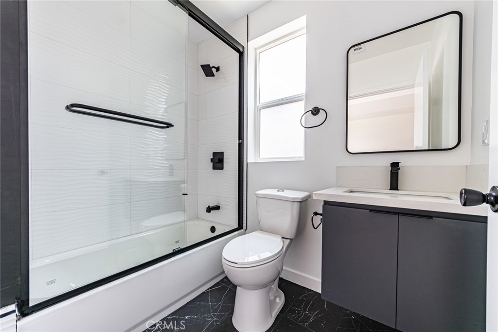 6700 Balboa Boulevard, Unit 1 Van Nuys, CA 91406 - Photo 21 of 54 a bathroom with a toilet sink vanity tub and shower