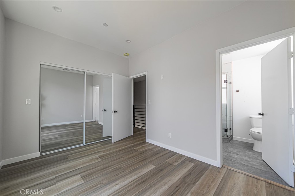 6700 Balboa Boulevard, Unit 1 Van Nuys, CA 91406 - Photo 25 of 54 a view of a room with wooden floor and a toilet