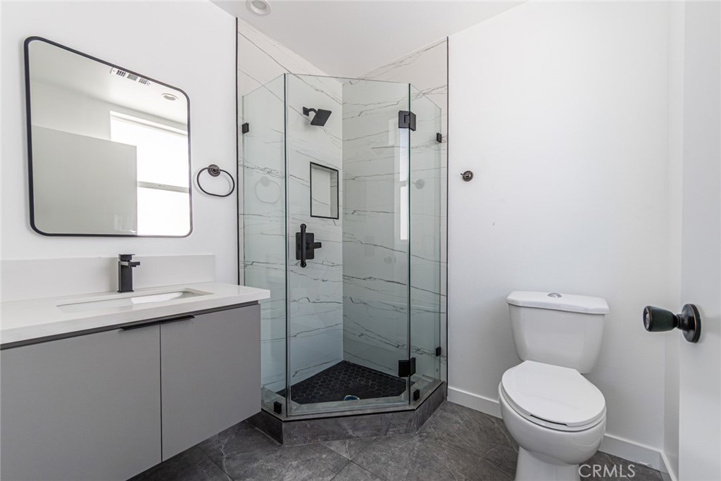 6700 Balboa Boulevard, Unit 1 Van Nuys, CA 91406 - Photo 27 of 54 a bathroom with a toilet sink and shower
