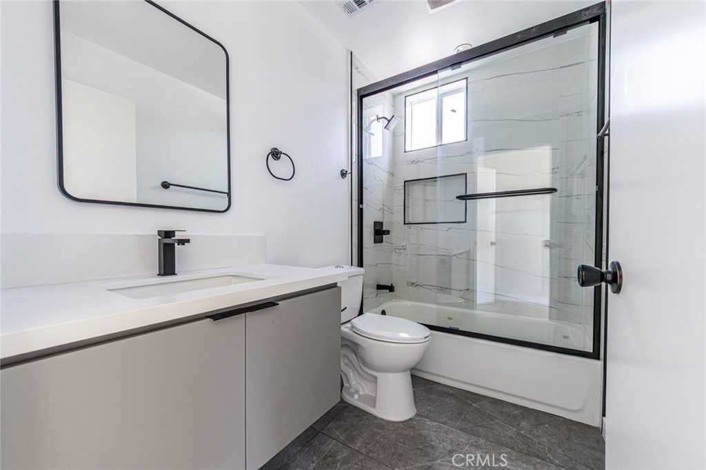 6700 Balboa Boulevard, Unit 1 Van Nuys, CA 91406 - Photo 30 of 54 a bathroom with a sink toilet and shower