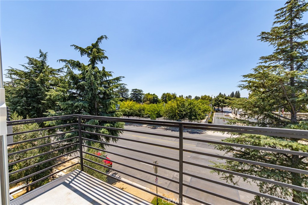 6700 Balboa Boulevard, Unit 1 Van Nuys, CA 91406 - Photo 31 of 54 a view of a balcony with wooden floor and plants