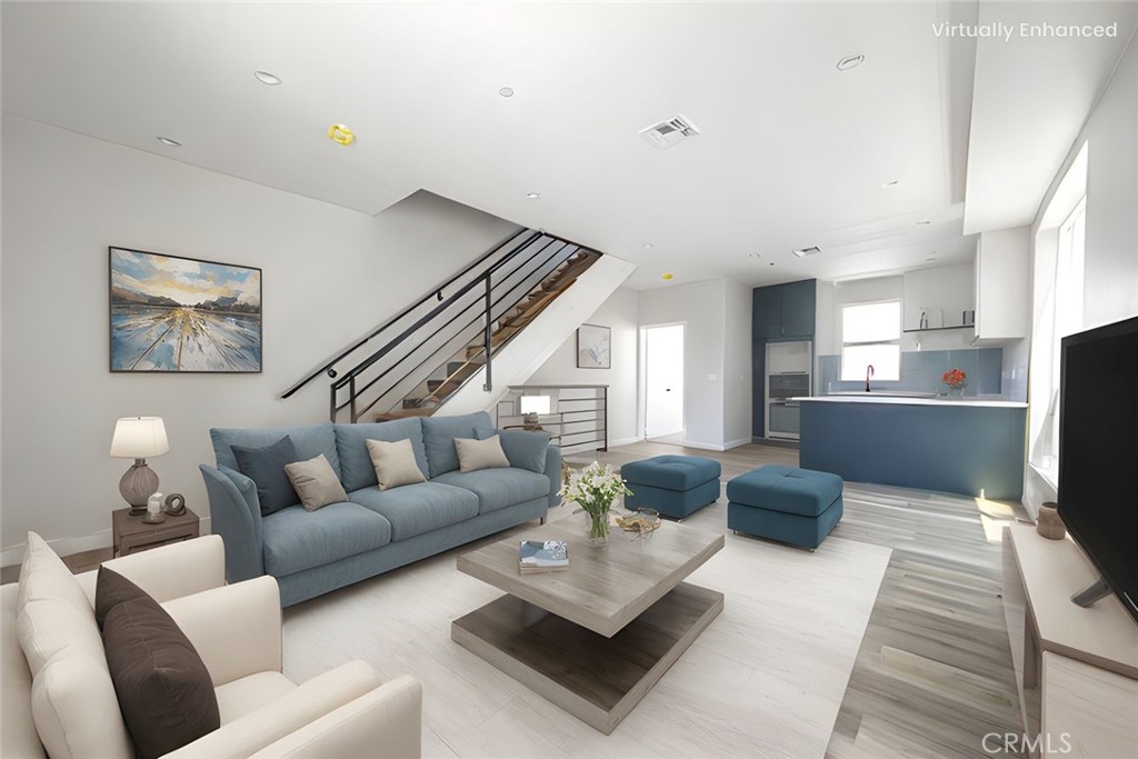 6700 Balboa Boulevard, Unit 1 Van Nuys, CA 91406 - Photo 4 of 54 a living room with furniture a flat screen tv and a fireplace