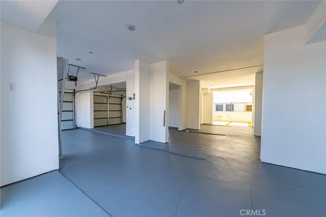 a view of room with stairs and wooden floor