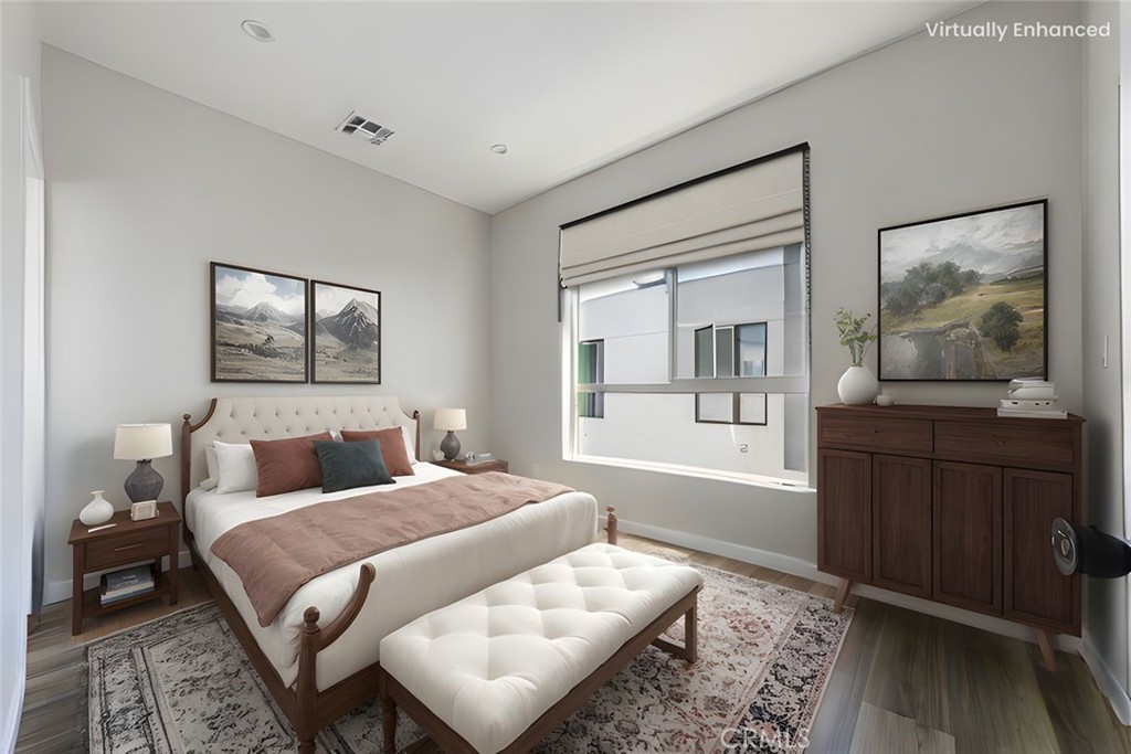 6700 Balboa Boulevard, Unit 1 Van Nuys, CA 91406 - Photo 5 of 54 a bedroom with a large bed and a window