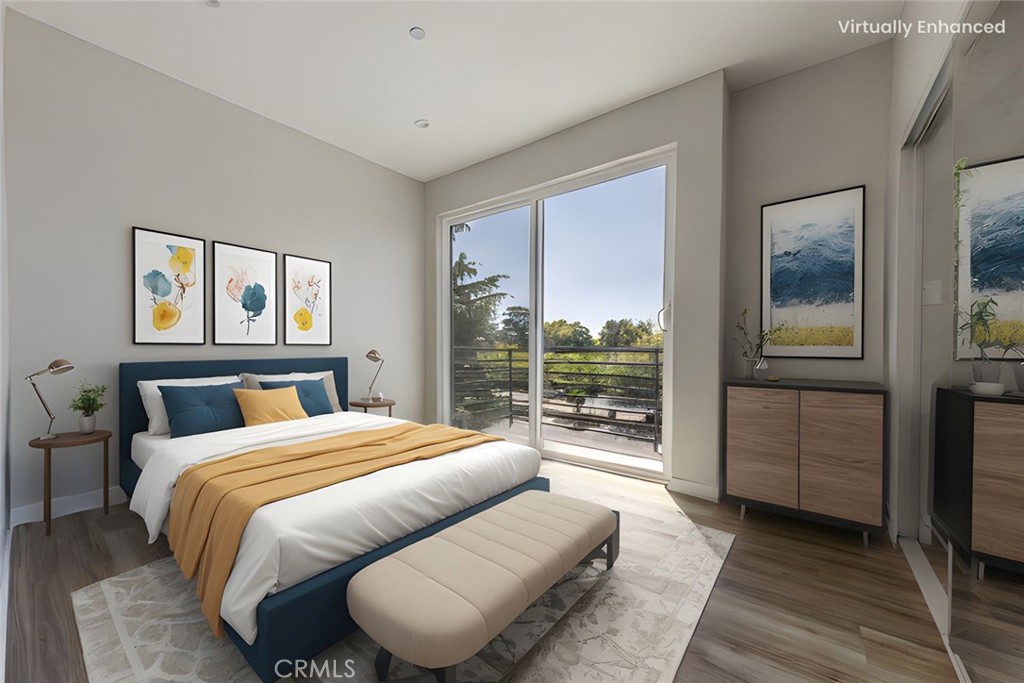 6700 Balboa Boulevard, Unit 1 Van Nuys, CA 91406 - Photo 6 of 54 a bedroom with a large bed and a large window