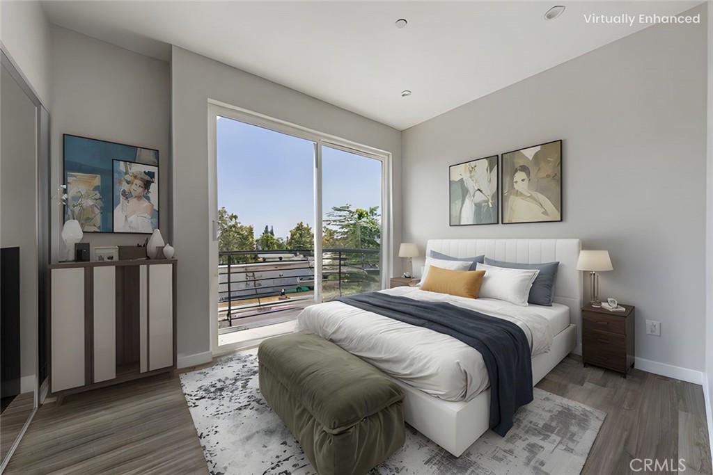 6700 Balboa Boulevard, Unit 1 Van Nuys, CA 91406 - Photo 7 of 54 a bedroom with a bed and wooden floor