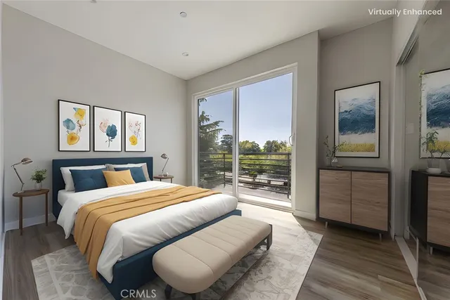 a bedroom with a large bed and a large window