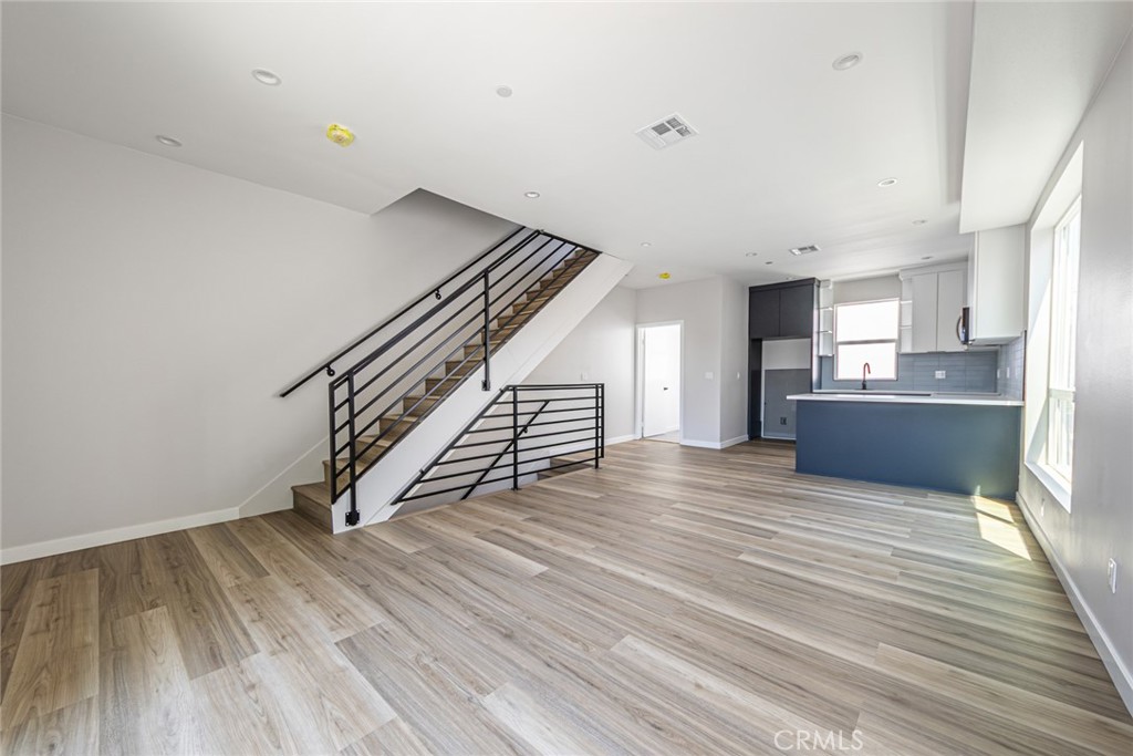 6700 Balboa Boulevard, Unit 1 Van Nuys, CA 91406 - Photo 10 of 54 a view of a kitchen with wooden floor and electronic appliances
