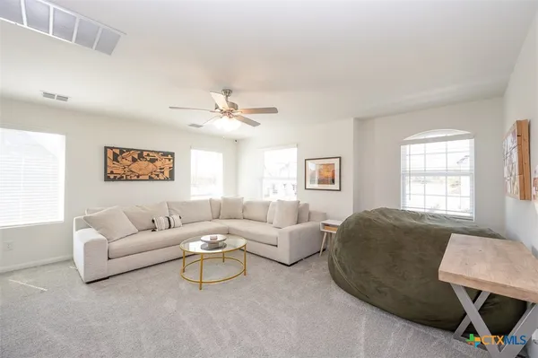 a living room with furniture and a window