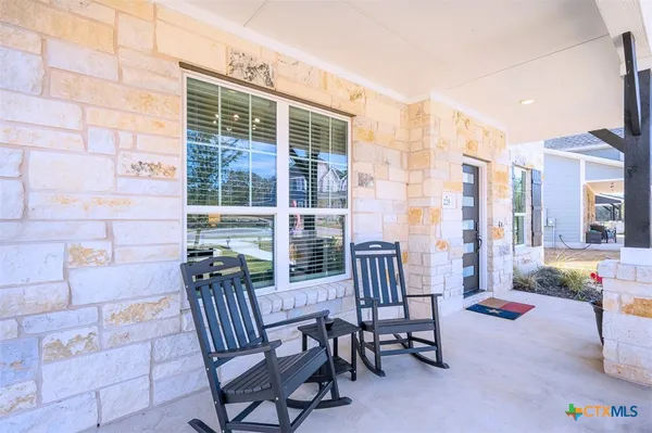 a view of a balcony with chairs