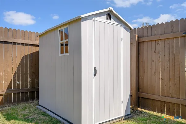 a house view with a backyard space