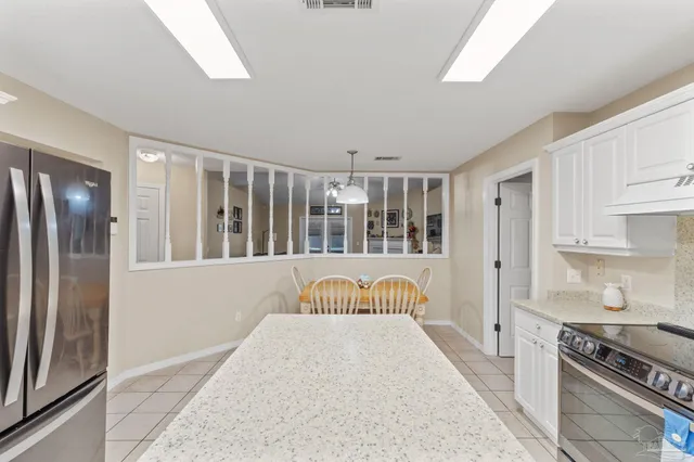 a spacious bedroom with a large bed and a window