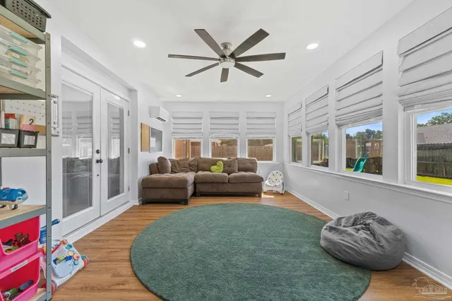 a living room with furniture and a large window