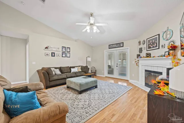 a living room with furniture and a fireplace