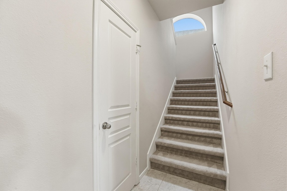 17415 Memorial Mills Drive Spring, TX 77379 - Photo 21 of 37 a view of staircase with white walls