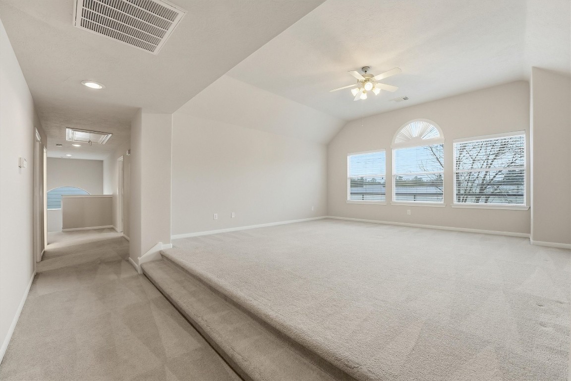 17415 Memorial Mills Drive Spring, TX 77379 - Photo 22 of 37 wooden floor in an empty room with a window