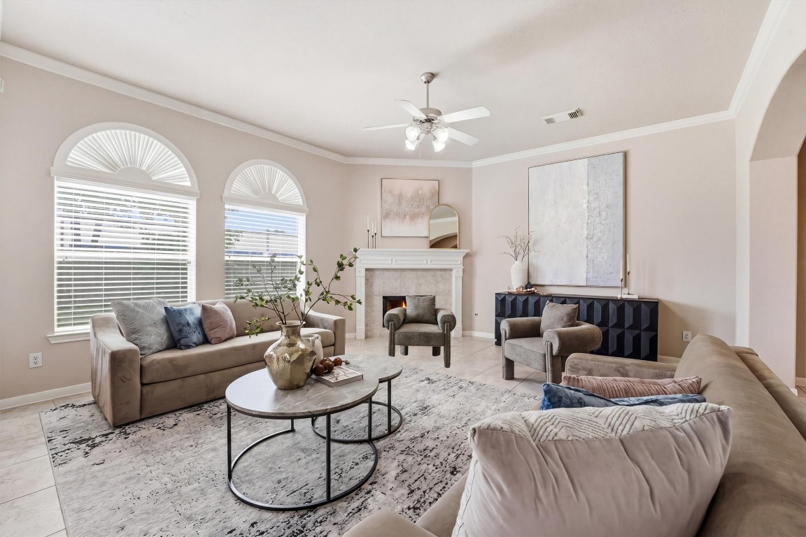 17415 Memorial Mills Drive Spring, TX 77379 - Photo 5 of 37 a living room with furniture a large window and a fireplace