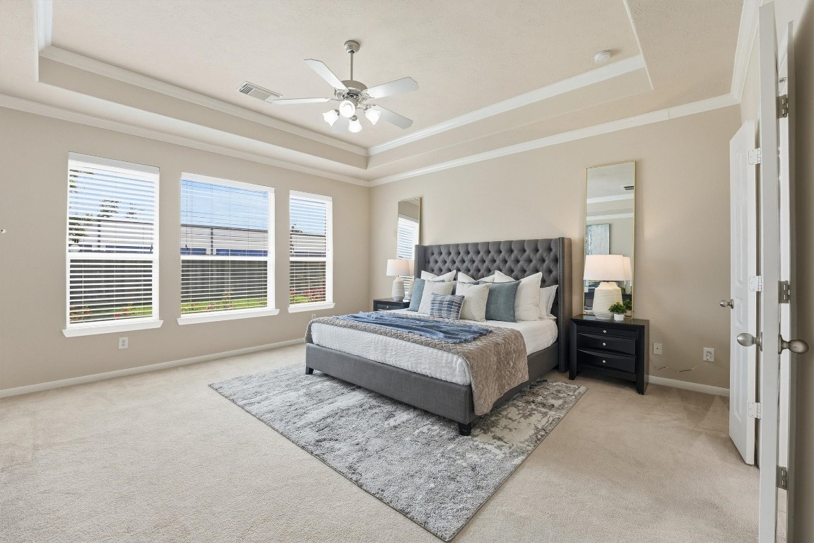 17415 Memorial Mills Drive Spring, TX 77379 - Photo 7 of 37 a spacious bedroom with a large bed and a chandelier