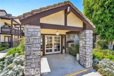 a view of a house with a small yard and plants