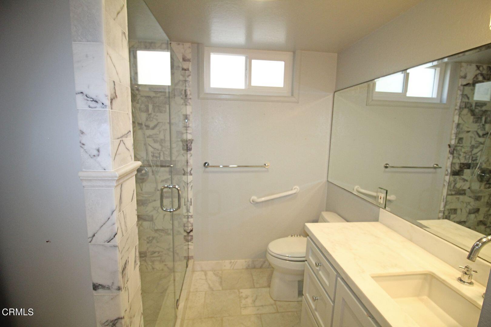 4185 Sunset Lane Oxnard, CA 93035 - Photo 20 of 32 a bathroom with a granite countertop sink toilet and shower