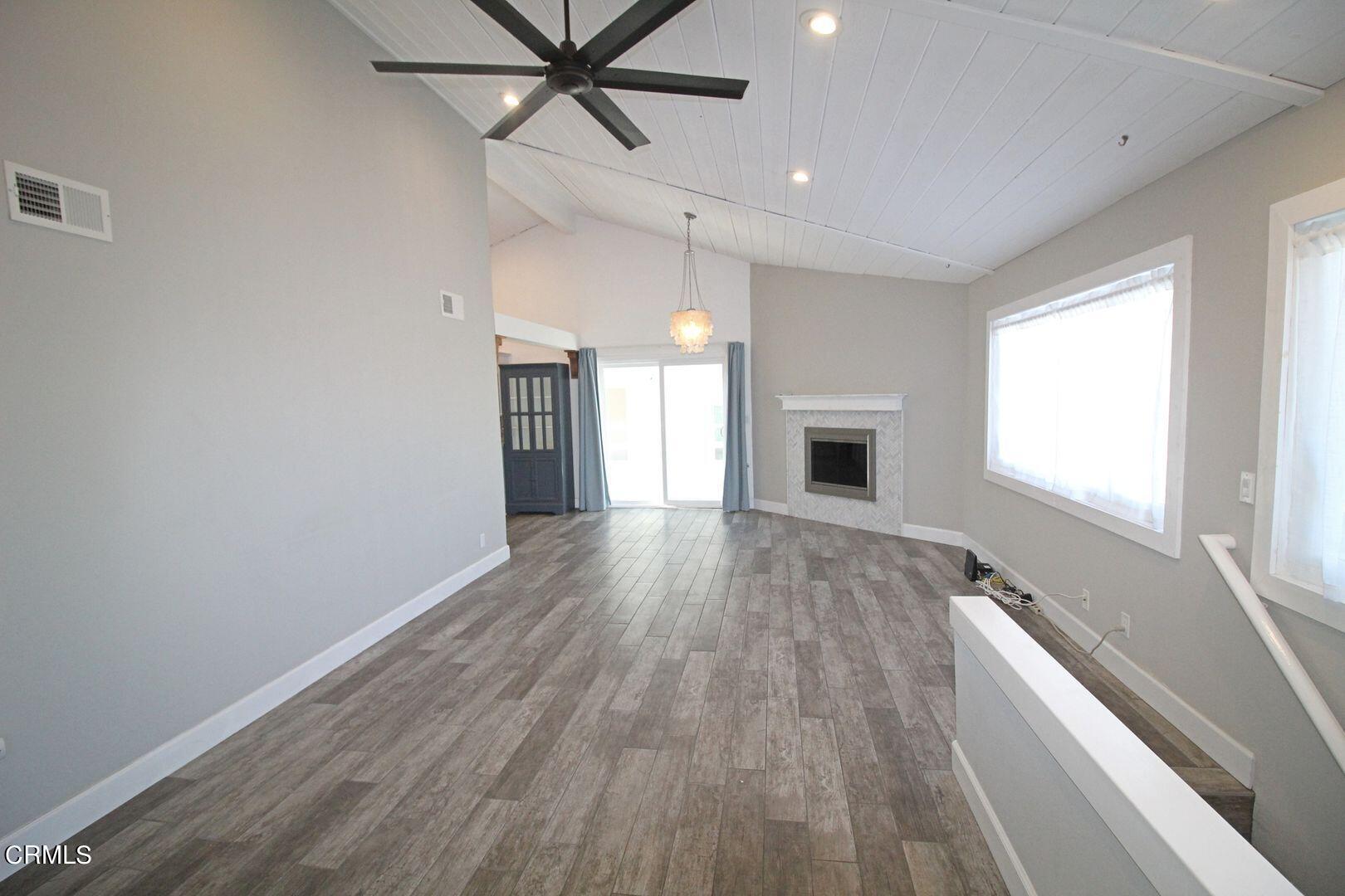 4185 Sunset Lane Oxnard, CA 93035 - Photo 2 of 32 a view of empty room with wooden floor and fan