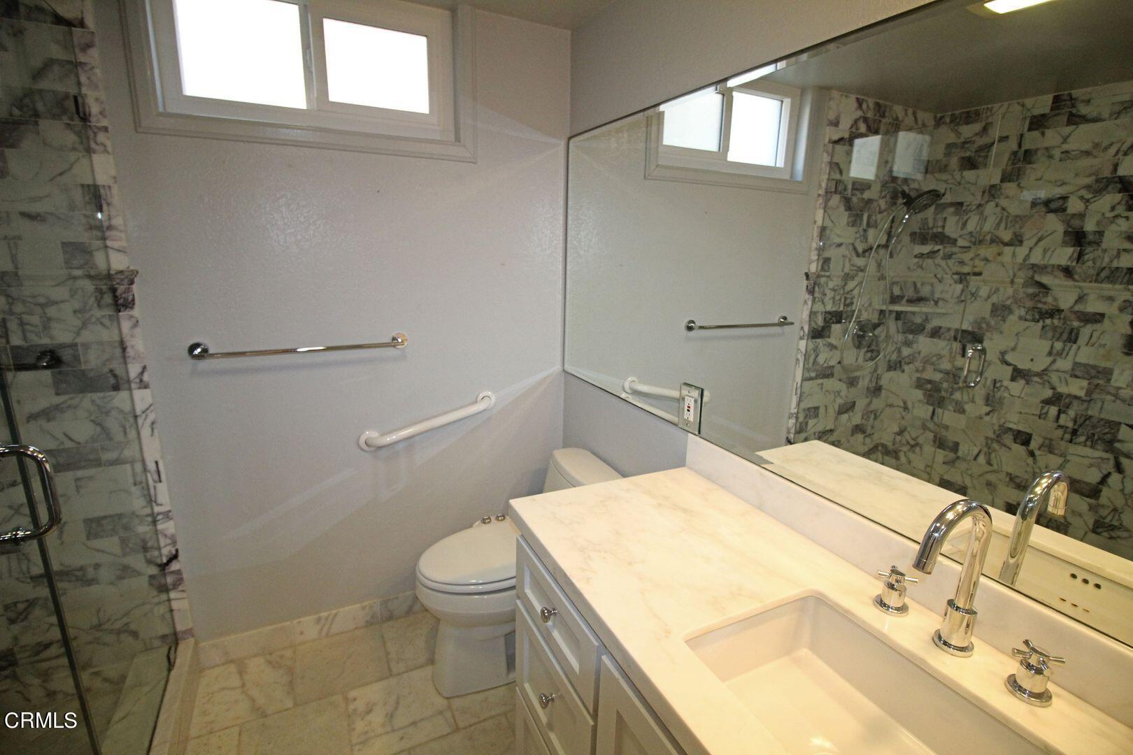 4185 Sunset Lane Oxnard, CA 93035 - Photo 21 of 32 a bathroom with a sink a toilet and shower